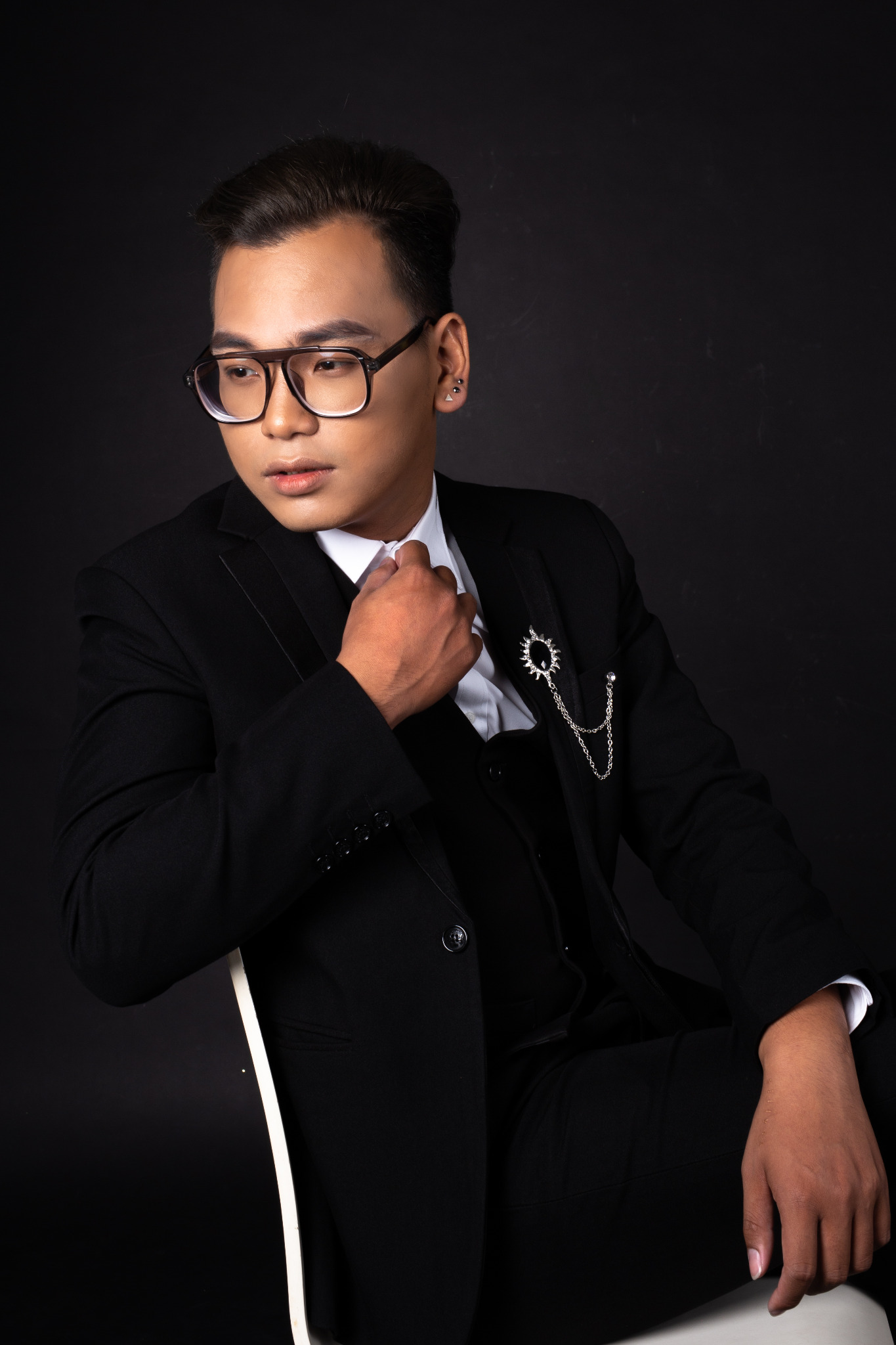 Portrait of DYAN. in a black suit